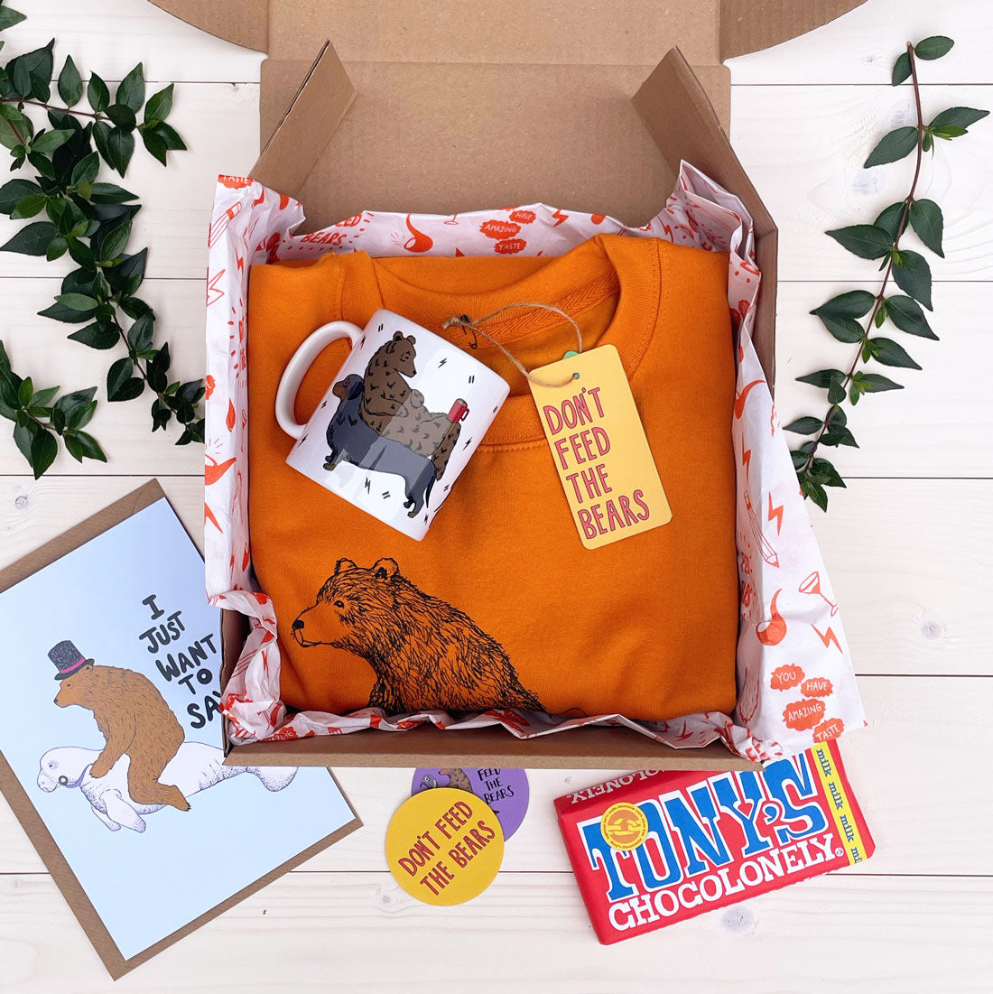 Open bear box with jumper and mug