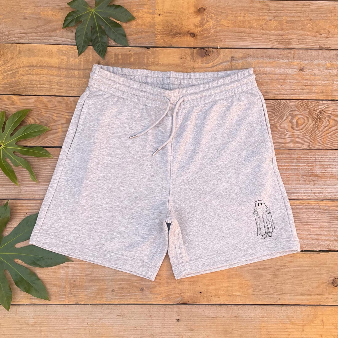 grey shorts with ghost bear design