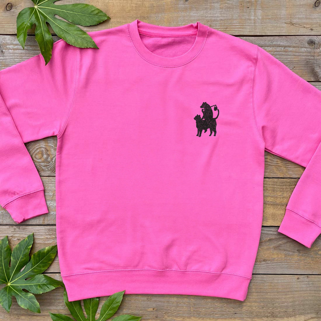 bear riding cat pocket print pink jumper