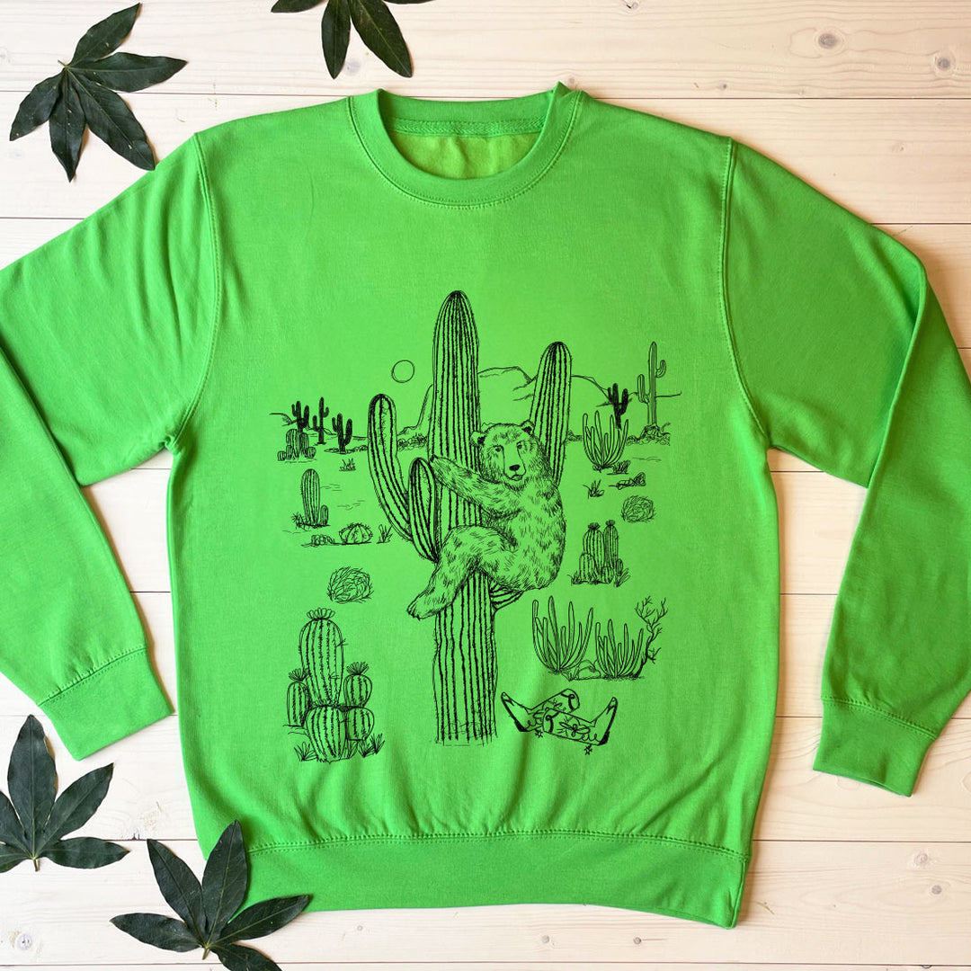 bear climbing cactus green jumper