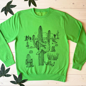 bear climbing cactus green jumper