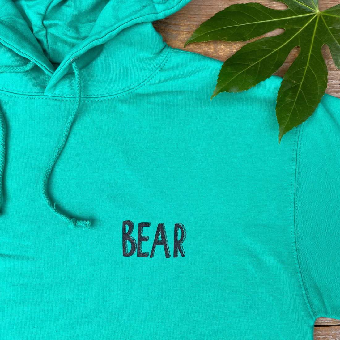 green hoodie bear text design