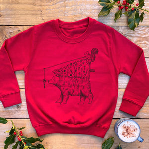 red kids xmas jumper with bear carrying xmas tree