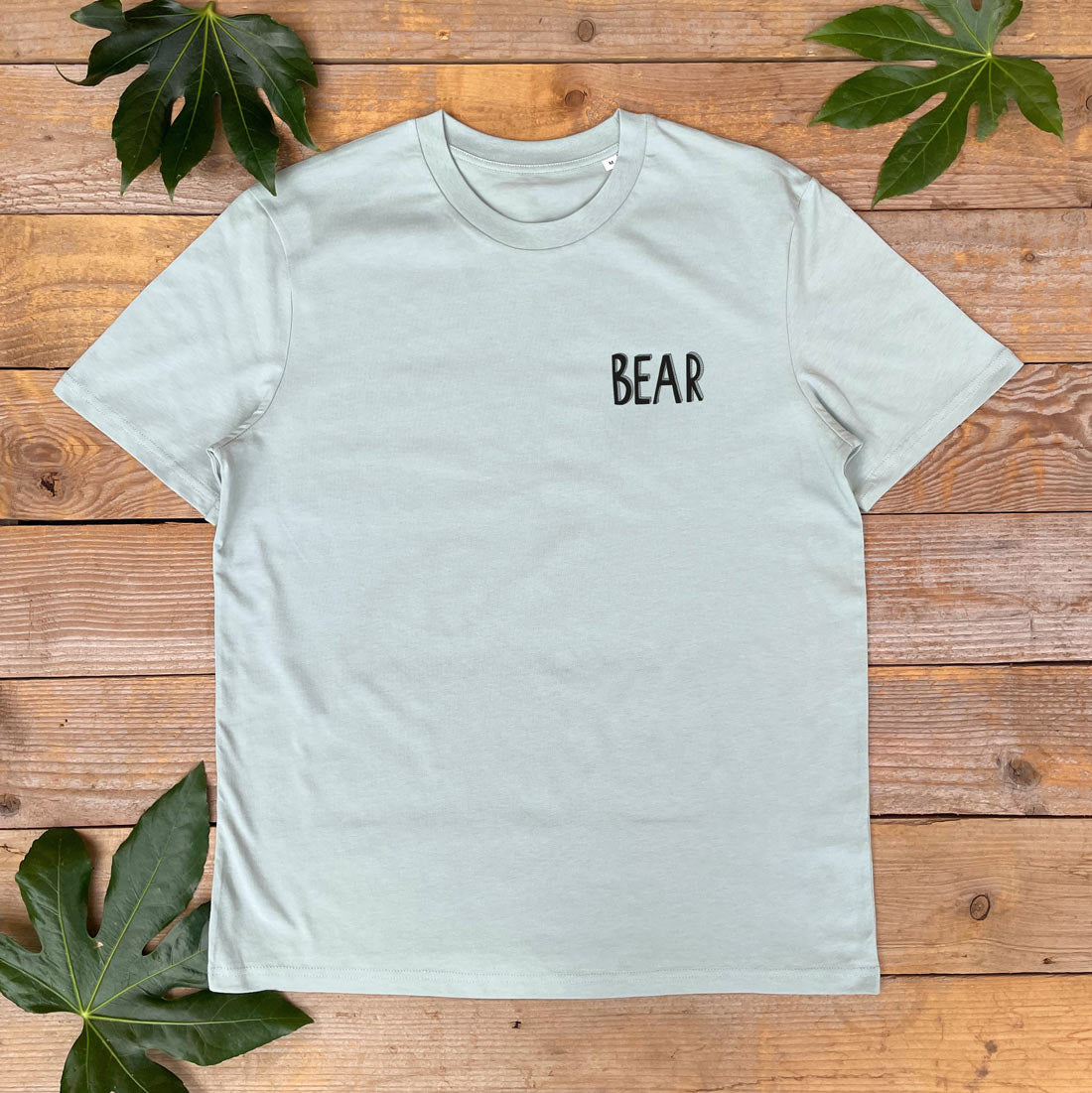 mint tee with bear text