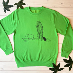 paddle boardng bear green jumper