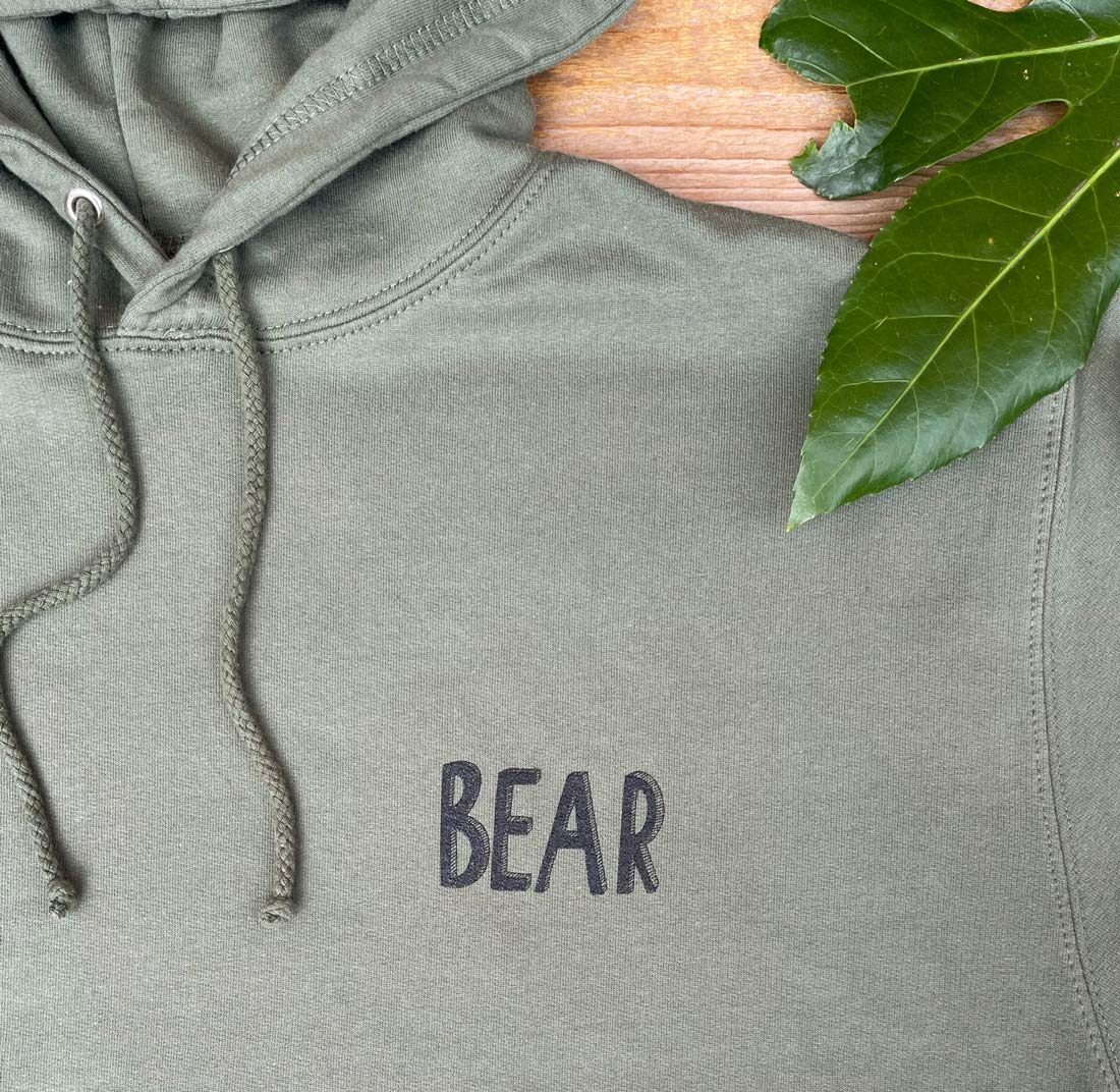 khaki hoodie with BEAR text print
