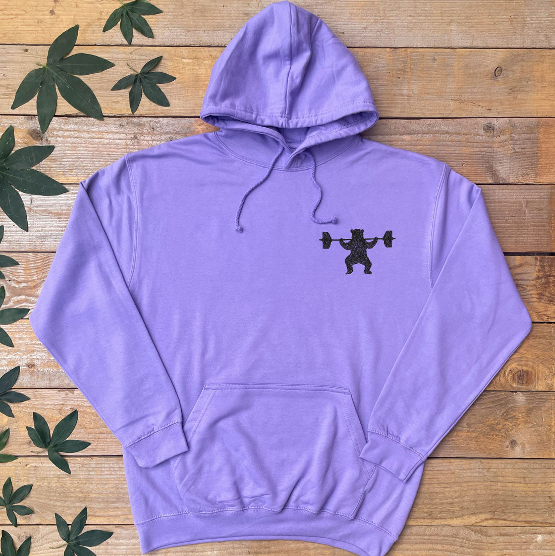 purple hoodie with bear lifting weights