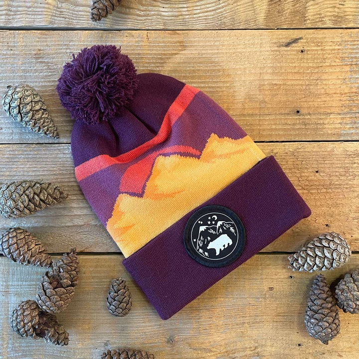 burgundy bobble hat with bear patch